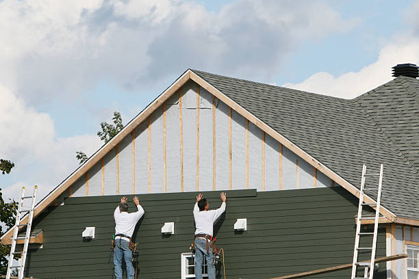 Professional Storm Damage Siding Repair technician working in Rice, MN